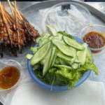 Grilled skewers with fresh vegetables and sauce in Da Nang Food Tours by X.o Food Tours